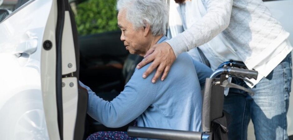caregiver-help-support-asian-elderly-woman-sitting-wheelchair-prepare-get-her-car-travel-holiday_39768-9892.jpg